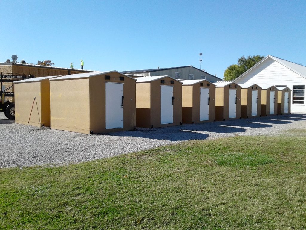 Above ground storm shelters